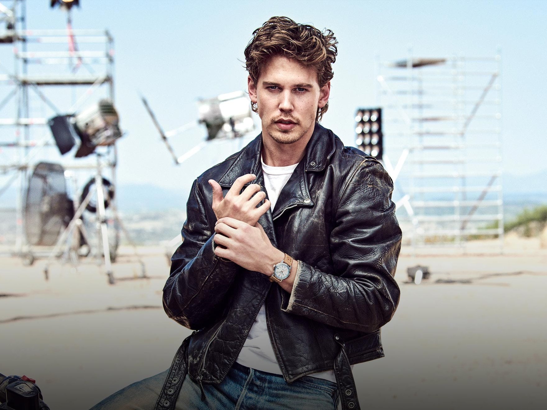 the man is wearing a leather jacket