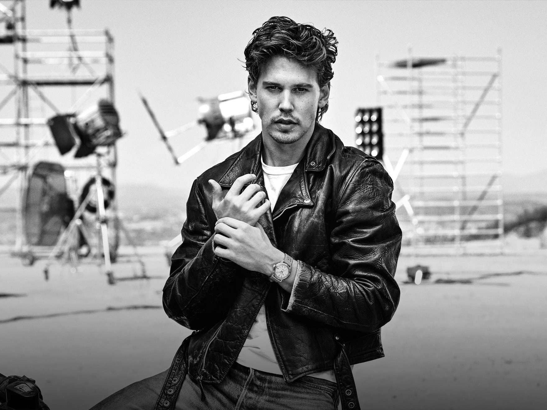 the man is wearing a leather jacket