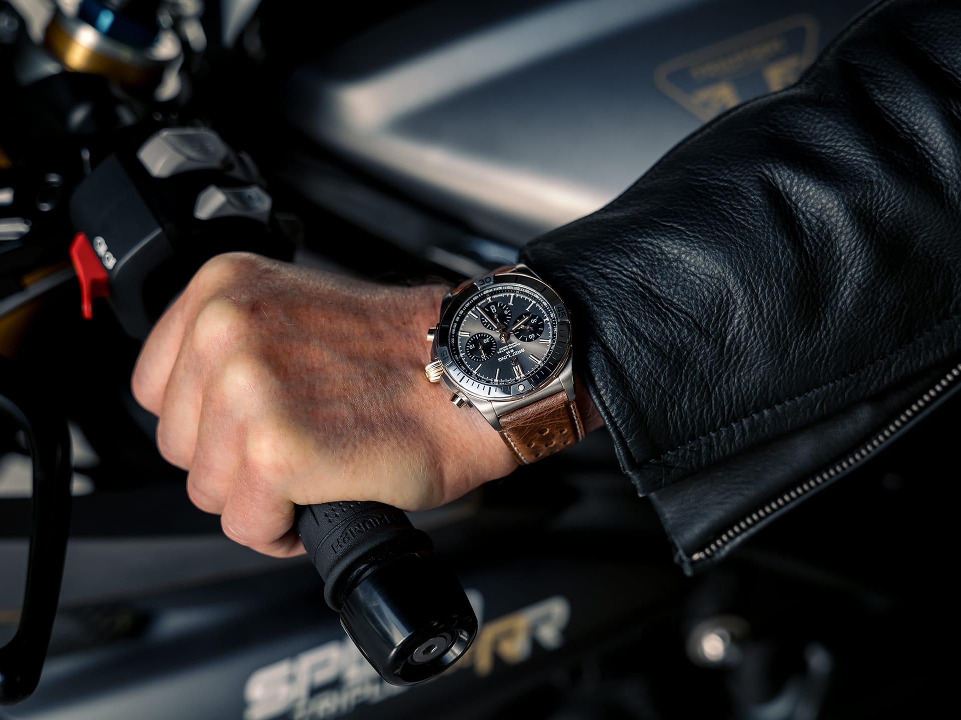 Breitling watch on the wrist of a motorcyclist